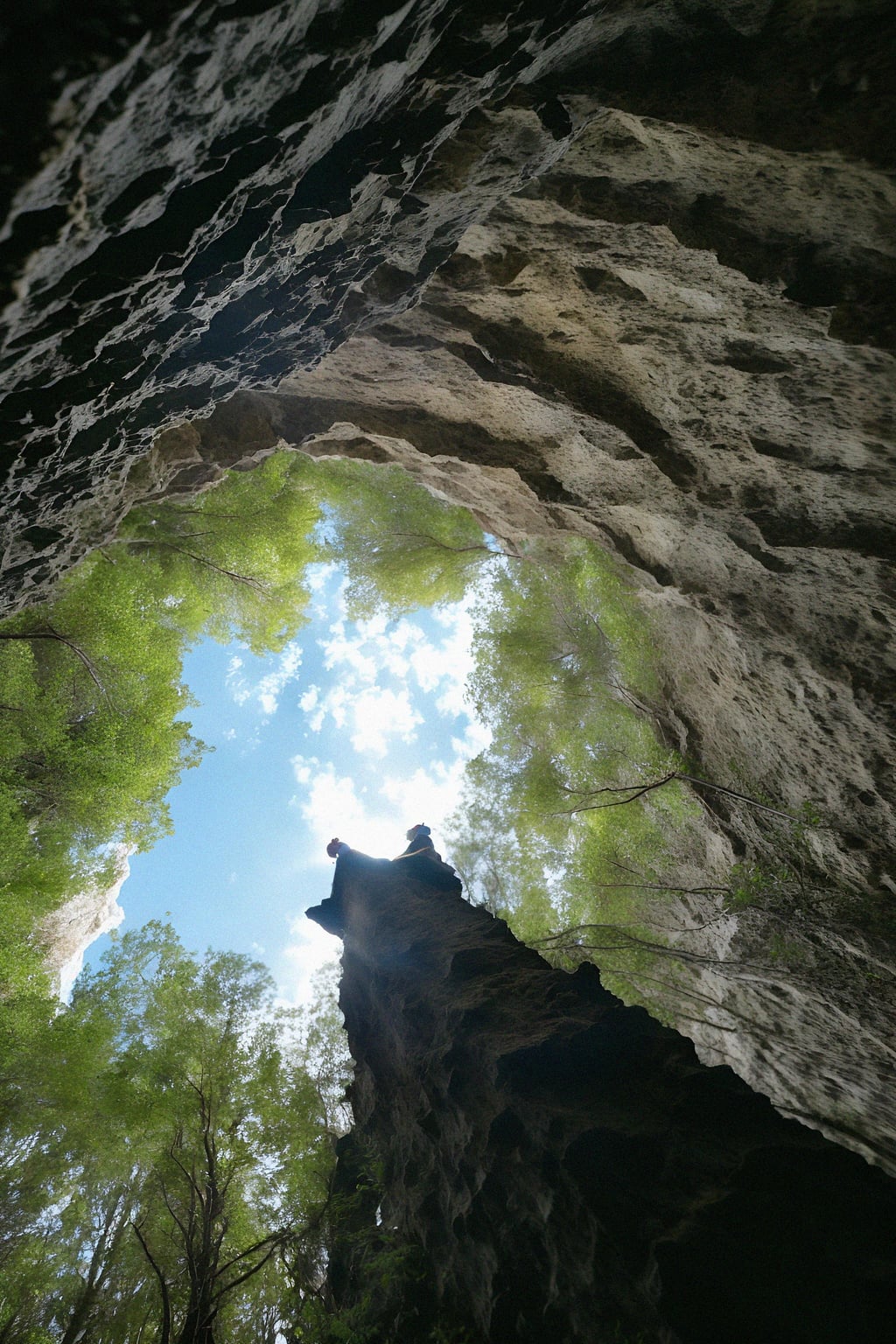 man as individual hiking through an impressive cave system