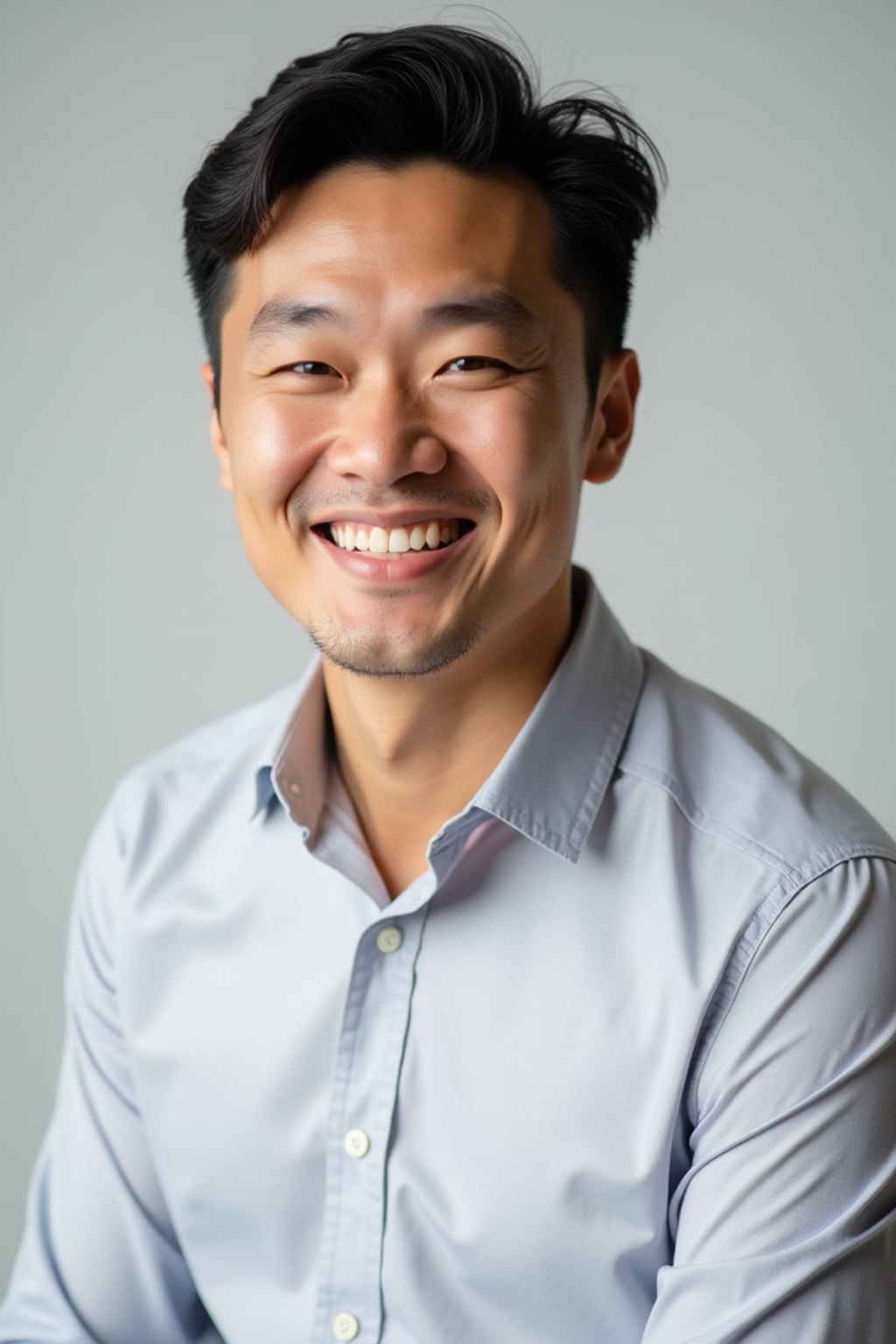 A professional life coach headshot of an inspiring man, taken in a well-lit studio with a plain backdrop. The man is dressed in  a neat, light-colored shirt with a motivational expression. The lighting is soft and even, highlighting their facial features with a warm and encouraging expression. The focus is sharp, capturing the man's eyes and uplifting smile, creating a perfect headshot for coaching practices and professional profiles.