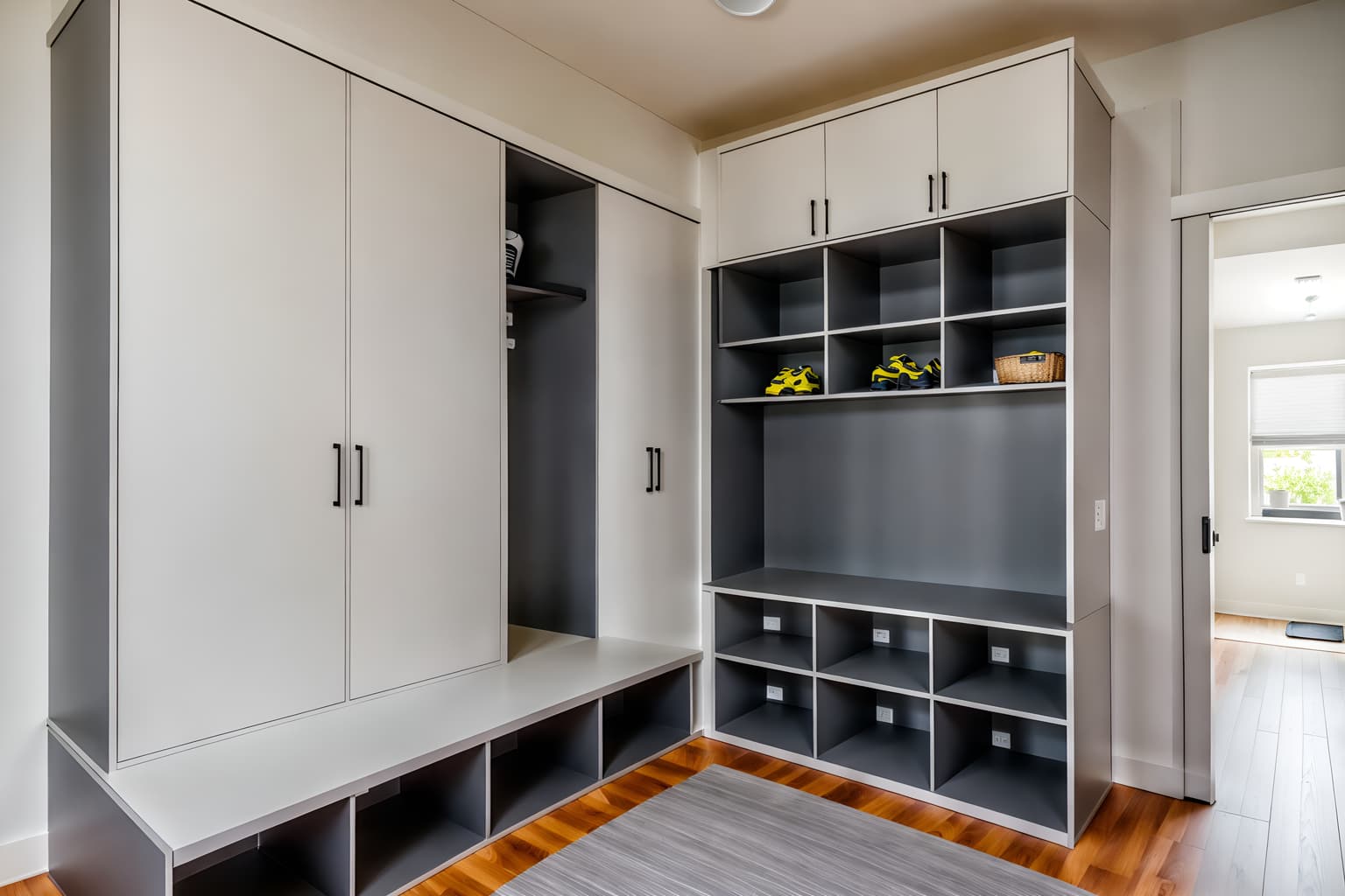 minimalist-style (mudroom interior) with storage drawers and high up storage and cubbies and storage baskets and cabinets and wall hooks for coats and shelves for shoes and a bench. . with focus on the shape, colour and texture of just a few of essential elements and functional furniture and an open floor plan and clean lines and a monochromatic palette with colour used as an accent and lots of light and focus on the shape, colour and texture of just a few of essential elements. . cinematic photo, highly detailed, cinematic lighting, ultra-detailed, ultrarealistic, photorealism, 8k. minimalist interior design style. masterpiece, cinematic light, ultrarealistic+, photorealistic+, 8k, raw photo, realistic, sharp focus on eyes, (symmetrical eyes), (intact eyes), hyperrealistic, highest quality, best quality, , highly detailed, masterpiece, best quality, extremely detailed 8k wallpaper, masterpiece, best quality, ultra-detailed, best shadow, detailed background, detailed face, detailed eyes, high contrast, best illumination, detailed face, dulux, caustic, dynamic angle, detailed glow. dramatic lighting. highly detailed, insanely detailed hair, symmetrical, intricate details, professionally retouched, 8k high definition. strong bokeh. award winning photo.