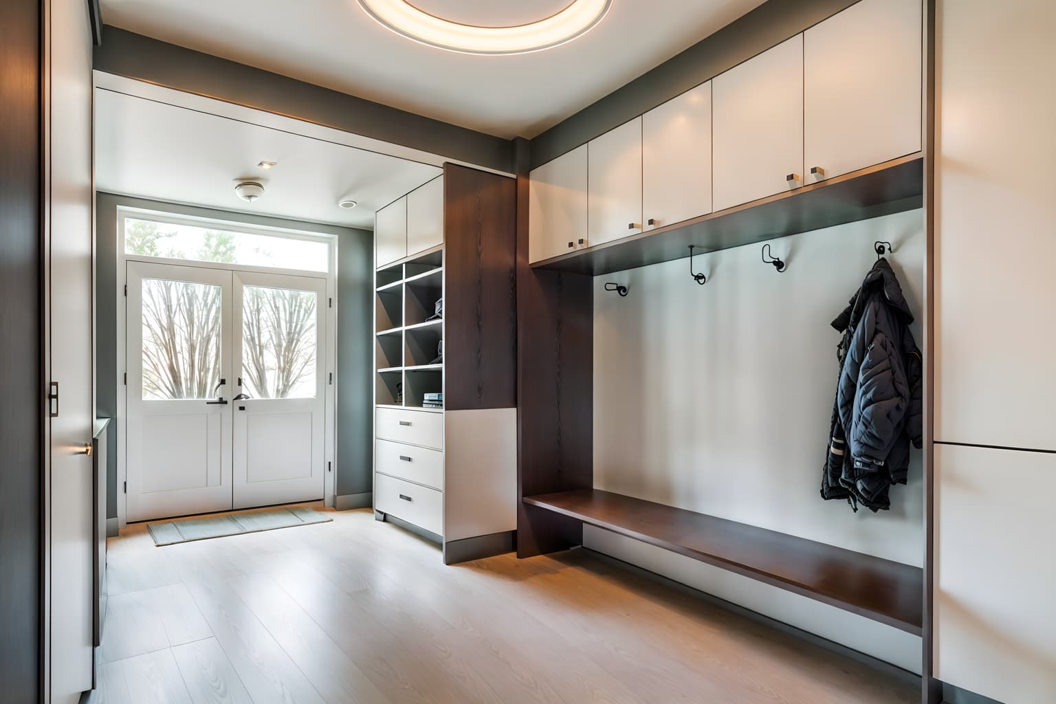 retro futuristic-style (mudroom interior) with a bench and wall hooks for coats and storage baskets and high up storage and storage drawers and cubbies and shelves for shoes and cabinets. . with glass panes and monochromatic palette and futurism minimalist interior and minimalist clean lines and steel finishing and circular shapes and neutral background and bright accents and light colors. . cinematic photo, highly detailed, cinematic lighting, ultra-detailed, ultrarealistic, photorealism, 8k. retro futuristic interior design style. masterpiece, cinematic light, ultrarealistic+, photorealistic+, 8k, raw photo, realistic, sharp focus on eyes, (symmetrical eyes), (intact eyes), hyperrealistic, highest quality, best quality, , highly detailed, masterpiece, best quality, extremely detailed 8k wallpaper, masterpiece, best quality, ultra-detailed, best shadow, detailed background, detailed face, detailed eyes, high contrast, best illumination, detailed face, dulux, caustic, dynamic angle, detailed glow. dramatic lighting. highly detailed, insanely detailed hair, symmetrical, intricate details, professionally retouched, 8k high definition. strong bokeh. award winning photo.