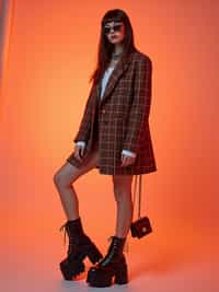 High-fashion E-Girl editorial shoot. Dressed in Y2K aesthetic, platform shoes, bold accessories . AI fashion-forward portrait.