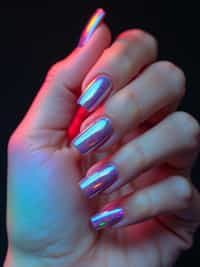 holographic chrome nails reflecting light spectrum, futuristic look, clean softbox lighting, posed fingers with high gloss