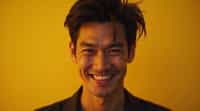 man with evil grin and mischievous look, gold background