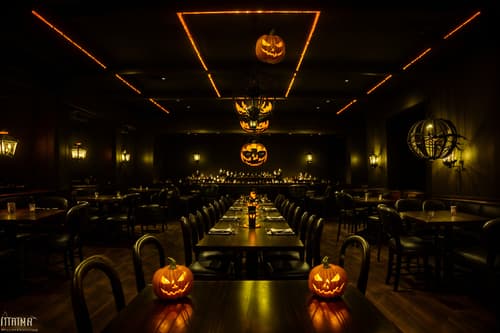 photo from pinterest of halloween-style interior designed (restaurant interior) with restaurant chairs and restaurant bar and restaurant decor and restaurant dining tables and restaurant chairs. . with glowing pumpkins and skeletons sitting and standing and lanterns and human skulls and spiderwebs and lanterns and cobwebs and yellow black balloons. . cinematic photo, highly detailed, cinematic lighting, ultra-detailed, ultrarealistic, photorealism, 8k. trending on pinterest. halloween interior design style. masterpiece, cinematic light, ultrarealistic+, photorealistic+, 8k, raw photo, realistic, sharp focus on eyes, (symmetrical eyes), (intact eyes), hyperrealistic, highest quality, best quality, , highly detailed, masterpiece, best quality, extremely detailed 8k wallpaper, masterpiece, best quality, ultra-detailed, best shadow, detailed background, detailed face, detailed eyes, high contrast, best illumination, detailed face, dulux, caustic, dynamic angle, detailed glow. dramatic lighting. highly detailed, insanely detailed hair, symmetrical, intricate details, professionally retouched, 8k high definition. strong bokeh. award winning photo.