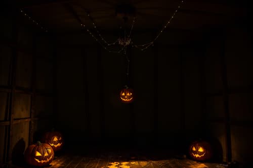 photo from pinterest of halloween-style interior designed (attic interior) . with glowing pumpkins and human skulls and yellow black balloons and cobwebs and lanterns and lanterns and spiderwebs and skeletons sitting and standing. . cinematic photo, highly detailed, cinematic lighting, ultra-detailed, ultrarealistic, photorealism, 8k. trending on pinterest. halloween interior design style. masterpiece, cinematic light, ultrarealistic+, photorealistic+, 8k, raw photo, realistic, sharp focus on eyes, (symmetrical eyes), (intact eyes), hyperrealistic, highest quality, best quality, , highly detailed, masterpiece, best quality, extremely detailed 8k wallpaper, masterpiece, best quality, ultra-detailed, best shadow, detailed background, detailed face, detailed eyes, high contrast, best illumination, detailed face, dulux, caustic, dynamic angle, detailed glow. dramatic lighting. highly detailed, insanely detailed hair, symmetrical, intricate details, professionally retouched, 8k high definition. strong bokeh. award winning photo.