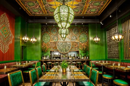 photo from pinterest of bohemian-style interior designed (restaurant interior) with restaurant chairs and restaurant dining tables and restaurant decor and restaurant bar and restaurant chairs. . with metals and mixed patterns and natural materials and bold patterns and lush green nature and carefree layers of pattern, texture, and color and playful patterns and playful colors. . cinematic photo, highly detailed, cinematic lighting, ultra-detailed, ultrarealistic, photorealism, 8k. trending on pinterest. bohemian interior design style. masterpiece, cinematic light, ultrarealistic+, photorealistic+, 8k, raw photo, realistic, sharp focus on eyes, (symmetrical eyes), (intact eyes), hyperrealistic, highest quality, best quality, , highly detailed, masterpiece, best quality, extremely detailed 8k wallpaper, masterpiece, best quality, ultra-detailed, best shadow, detailed background, detailed face, detailed eyes, high contrast, best illumination, detailed face, dulux, caustic, dynamic angle, detailed glow. dramatic lighting. highly detailed, insanely detailed hair, symmetrical, intricate details, professionally retouched, 8k high definition. strong bokeh. award winning photo.
