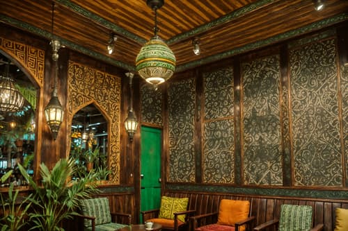 photo from pinterest of bohemian-style interior designed (coffee shop interior) . with metals and playful patterns and bold patterns and carefree layers of pattern, texture, and color and mixed patterns and woods and travel trinkets and lush green nature. . cinematic photo, highly detailed, cinematic lighting, ultra-detailed, ultrarealistic, photorealism, 8k. trending on pinterest. bohemian interior design style. masterpiece, cinematic light, ultrarealistic+, photorealistic+, 8k, raw photo, realistic, sharp focus on eyes, (symmetrical eyes), (intact eyes), hyperrealistic, highest quality, best quality, , highly detailed, masterpiece, best quality, extremely detailed 8k wallpaper, masterpiece, best quality, ultra-detailed, best shadow, detailed background, detailed face, detailed eyes, high contrast, best illumination, detailed face, dulux, caustic, dynamic angle, detailed glow. dramatic lighting. highly detailed, insanely detailed hair, symmetrical, intricate details, professionally retouched, 8k high definition. strong bokeh. award winning photo.