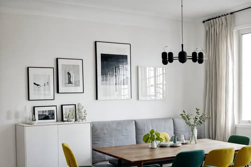 photo from pinterest of minimalist-style interior designed (dining room interior) with painting or photo on wall and table cloth and plates, cutlery and glasses on dining table and plant and bookshelves and dining table and light or chandelier and vase. . with an open floor plan and a monochromatic palette with colour used as an accent and lots of light and focus on the shape, colour and texture of just a few of essential elements and functional furniture and clean lines and an open floor plan. . cinematic photo, highly detailed, cinematic lighting, ultra-detailed, ultrarealistic, photorealism, 8k. trending on pinterest. minimalist interior design style. masterpiece, cinematic light, ultrarealistic+, photorealistic+, 8k, raw photo, realistic, sharp focus on eyes, (symmetrical eyes), (intact eyes), hyperrealistic, highest quality, best quality, , highly detailed, masterpiece, best quality, extremely detailed 8k wallpaper, masterpiece, best quality, ultra-detailed, best shadow, detailed background, detailed face, detailed eyes, high contrast, best illumination, detailed face, dulux, caustic, dynamic angle, detailed glow. dramatic lighting. highly detailed, insanely detailed hair, symmetrical, intricate details, professionally retouched, 8k high definition. strong bokeh. award winning photo.